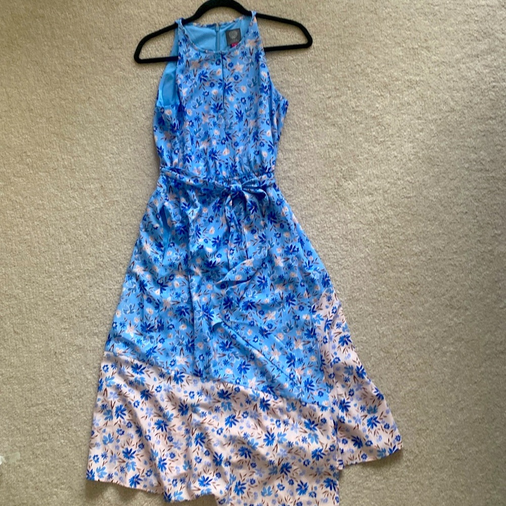 Vince Camuto floral dress in size 6 that falls mid-shin with belt and slip.